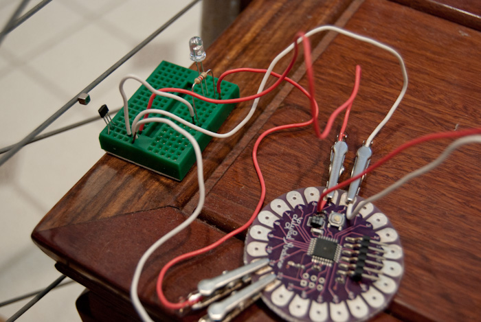 wheel and breadboarded circuit with magnet, close