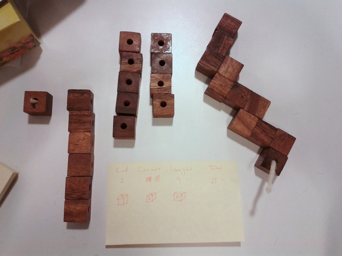 broken snake cube puzzle, with note