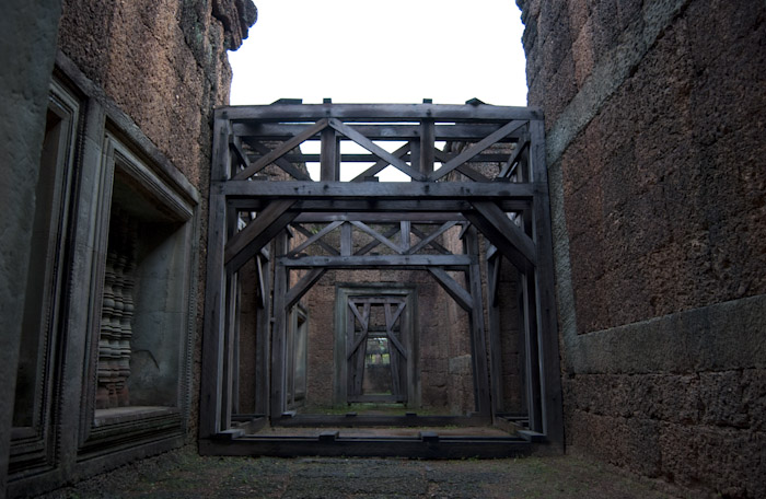 cubic wooden support structure, low view along corridor