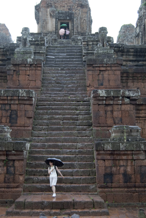 woman at bottom of temple staircase