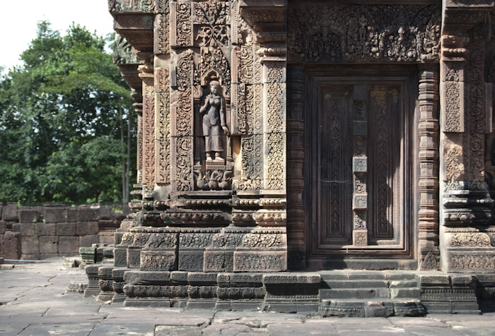 doorway and surrounding carvings with figure