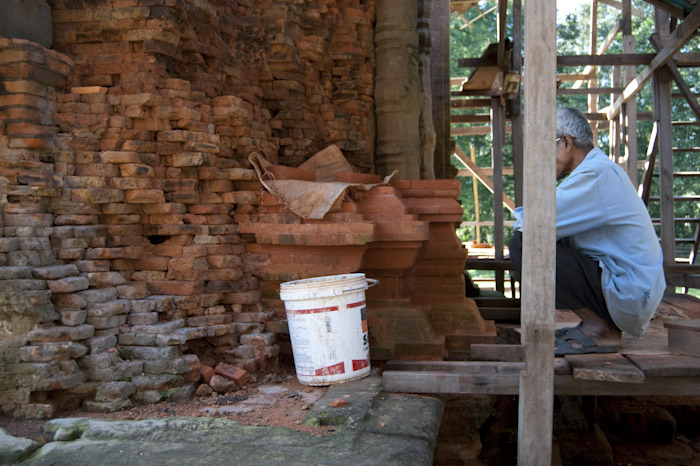 man with brick restoration