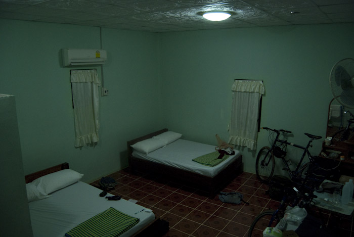 cabin room with beds and bikes