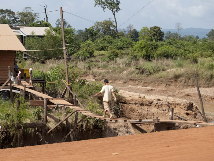 man on wooden bridge