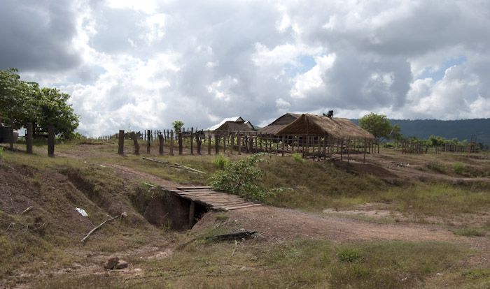 man thatching roof