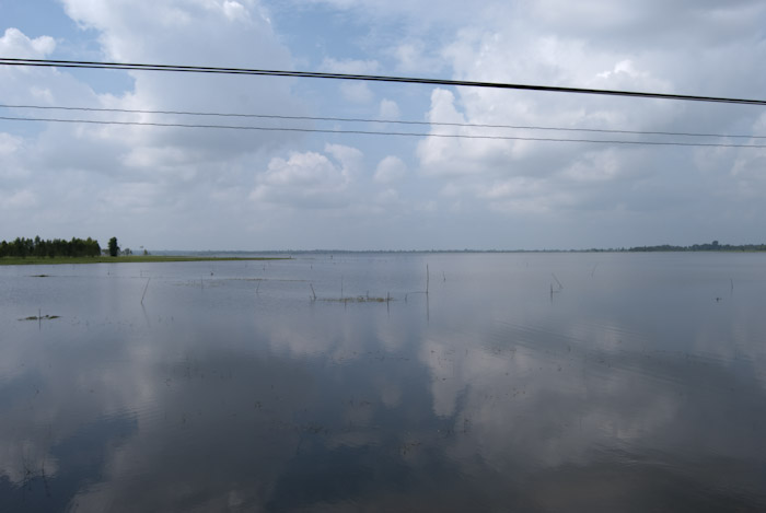 clouds and wires over lake