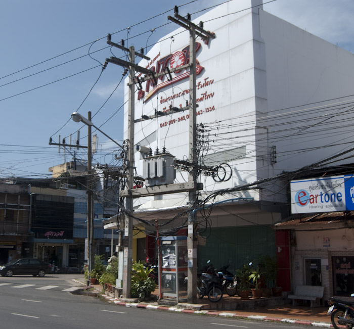 wires in front of white building